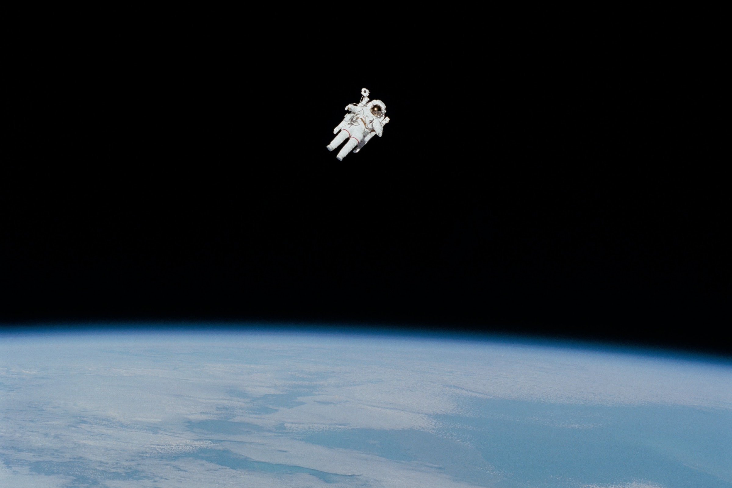 Astronaut floating above the Earth